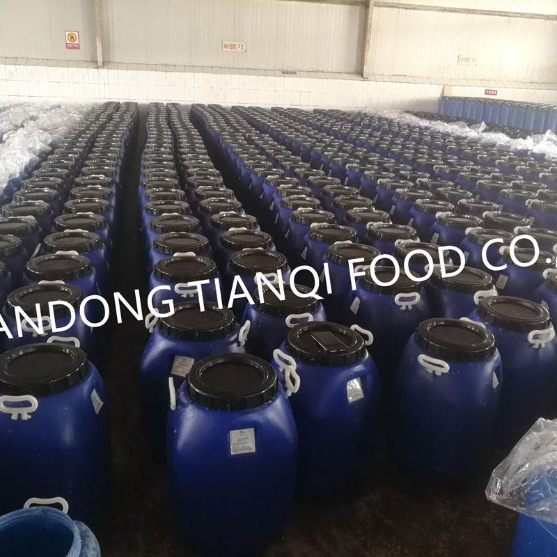 Garlic in salted water in drums